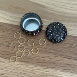 Floral Tin with hexagon stitch markers
