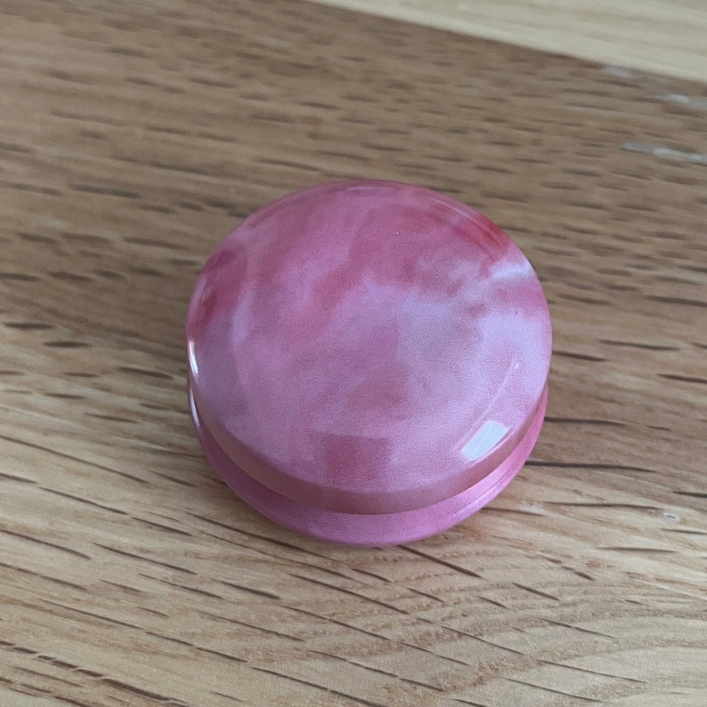 Marbled tins with spiral stitch markers