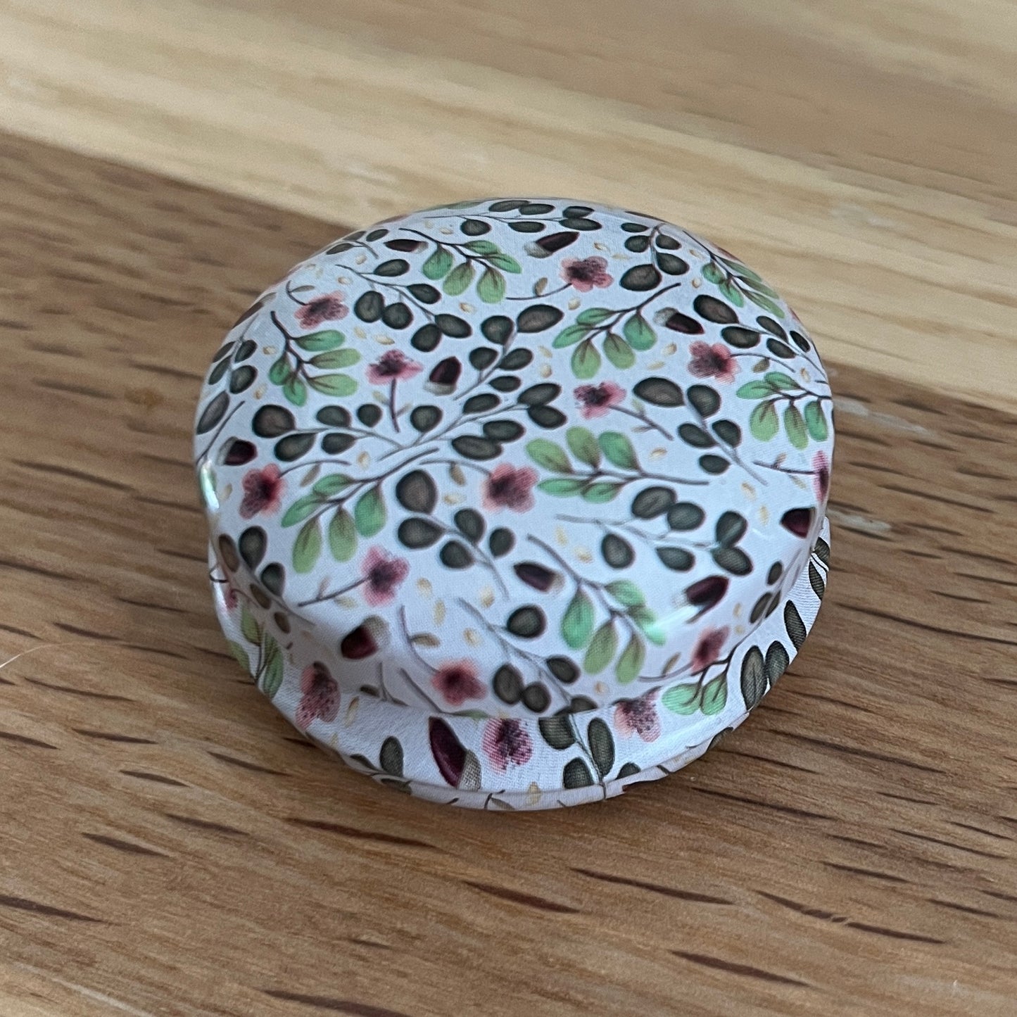 Floral Tin with hexagon stitch markers