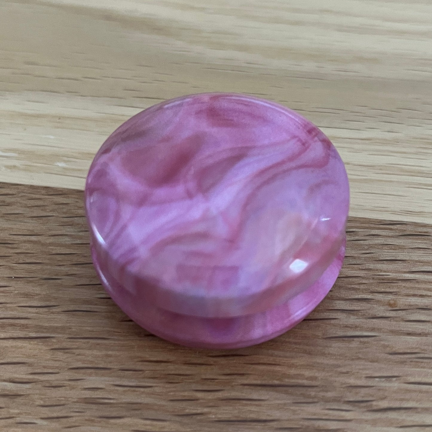 Marbled tins with spiral stitch markers