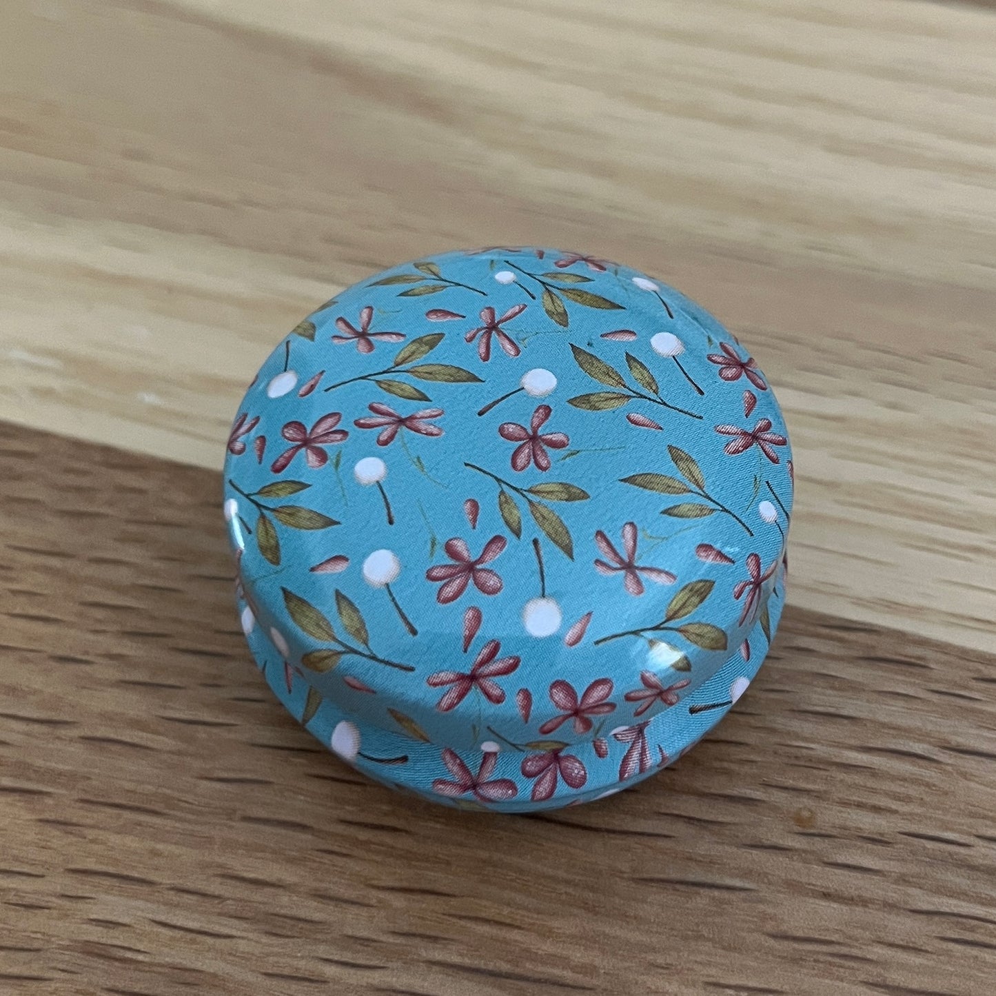 Floral Tin with hexagon stitch markers