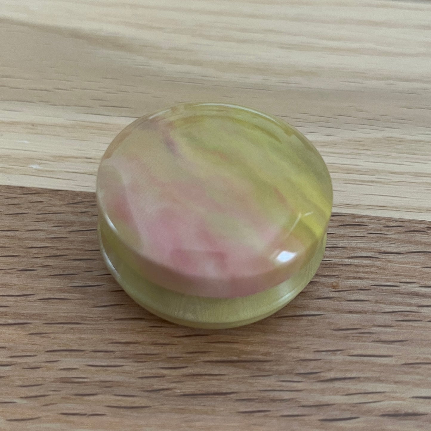 Marbled tins with spiral stitch markers