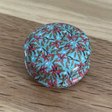 Floral Tin with hexagon stitch markers