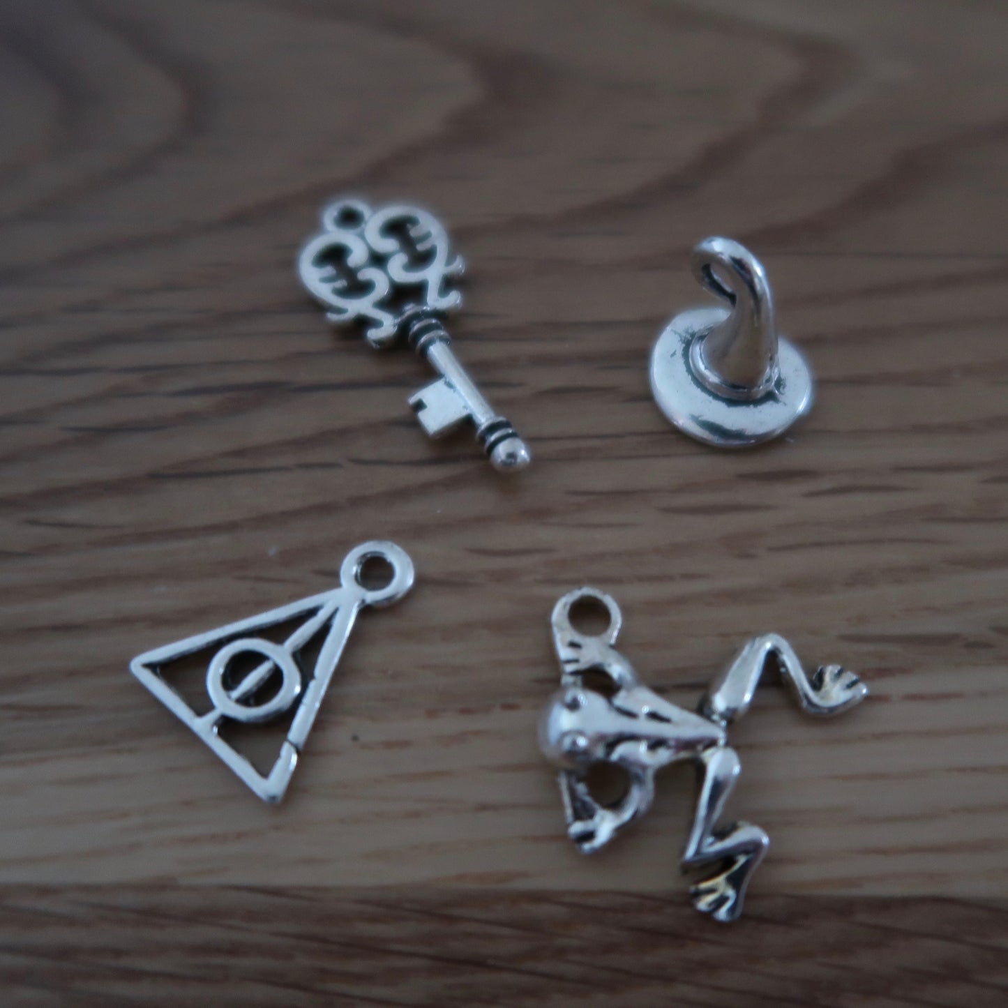 Wizard inspired stitch markers or progress keepers (set of 4) frog / wizard hat / key / symbol