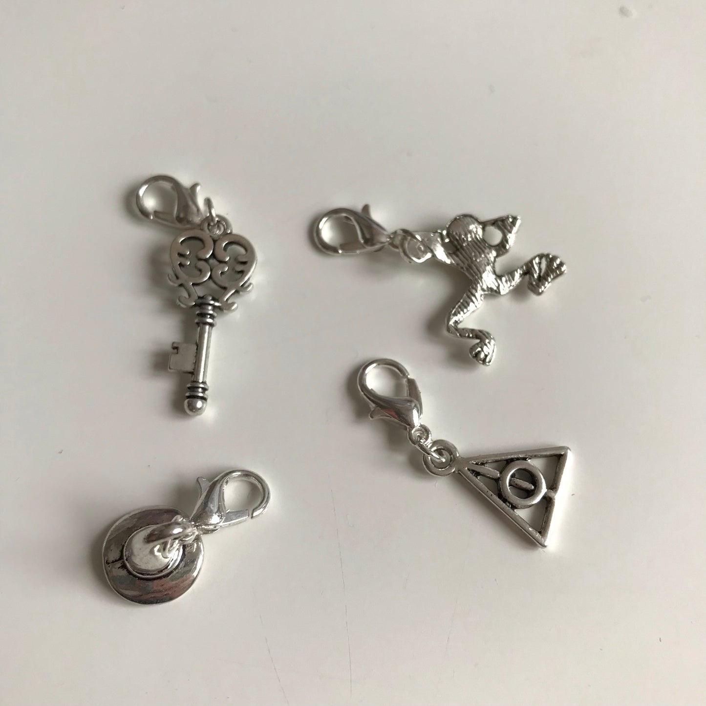 Wizard inspired stitch markers or progress keepers (set of 4) frog / wizard hat / key / symbol